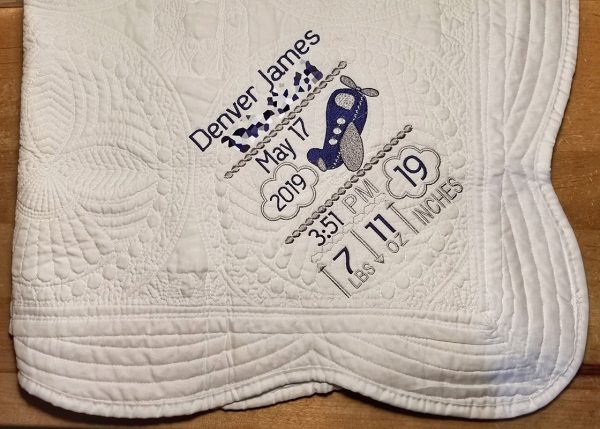Personalized baby blanket with embroidered name and birth information