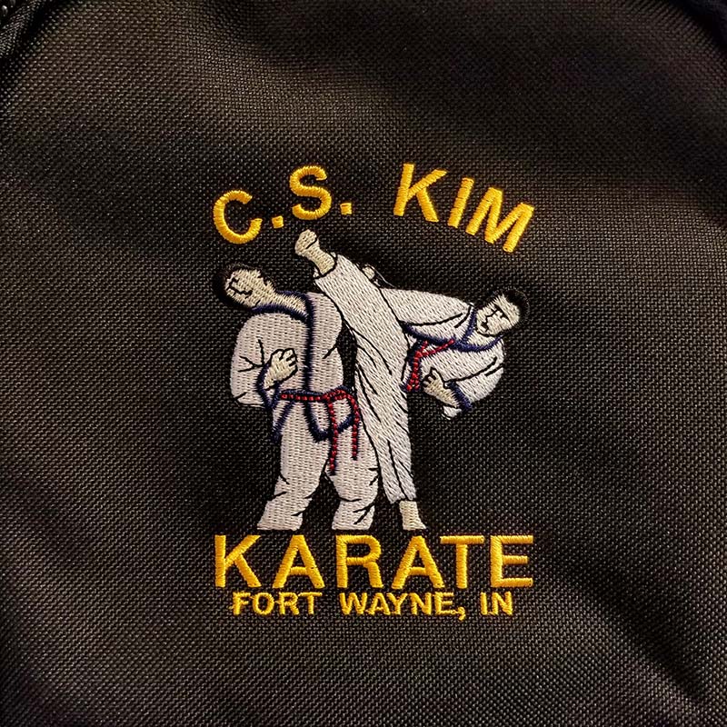 Close-up of the embroidered logo for C.S. Kim Karate