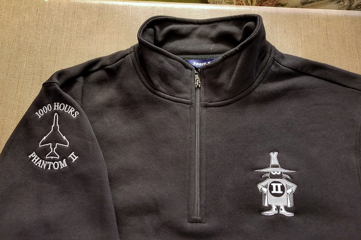 Quarter zip pullover with the F4 Phantom Spook embroidered on the left chest and the 1000 Hours flight time signifier on the right upper arm