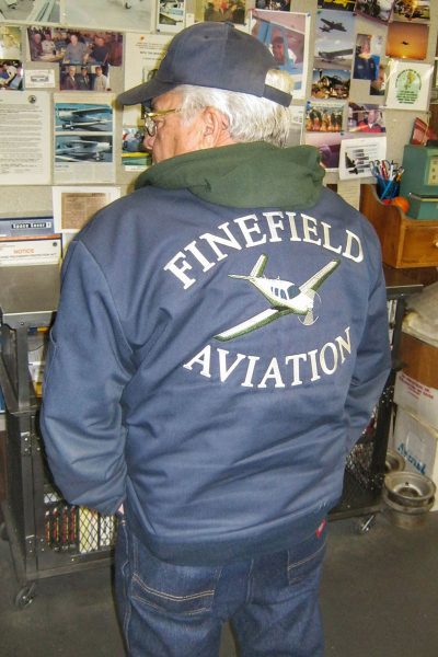 Jacket with Finefield Aviation and an airplane embroidered on the back
