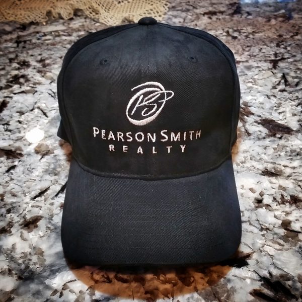 Black baseball cap (Hat Style CP80) with the Pearson Smith Realty logo embroidered on the front