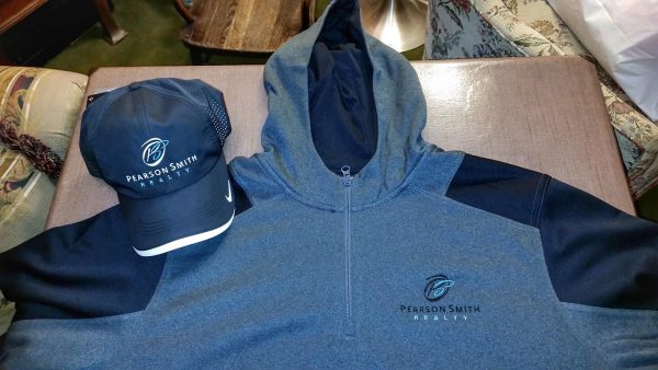 Baseball Cap and Quarter Zip Hoodie embroidered with Pearson Smith Realty logo