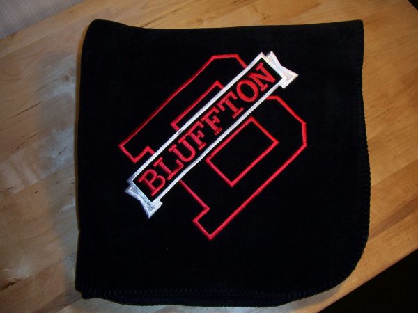 Black fleece blanket with a red capital B and a white banner with red letters that says BLUFFTON running across it